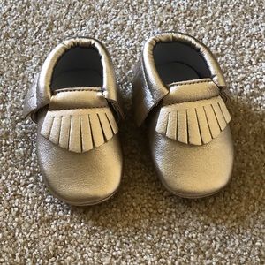 Two pairs of little girl moccasins